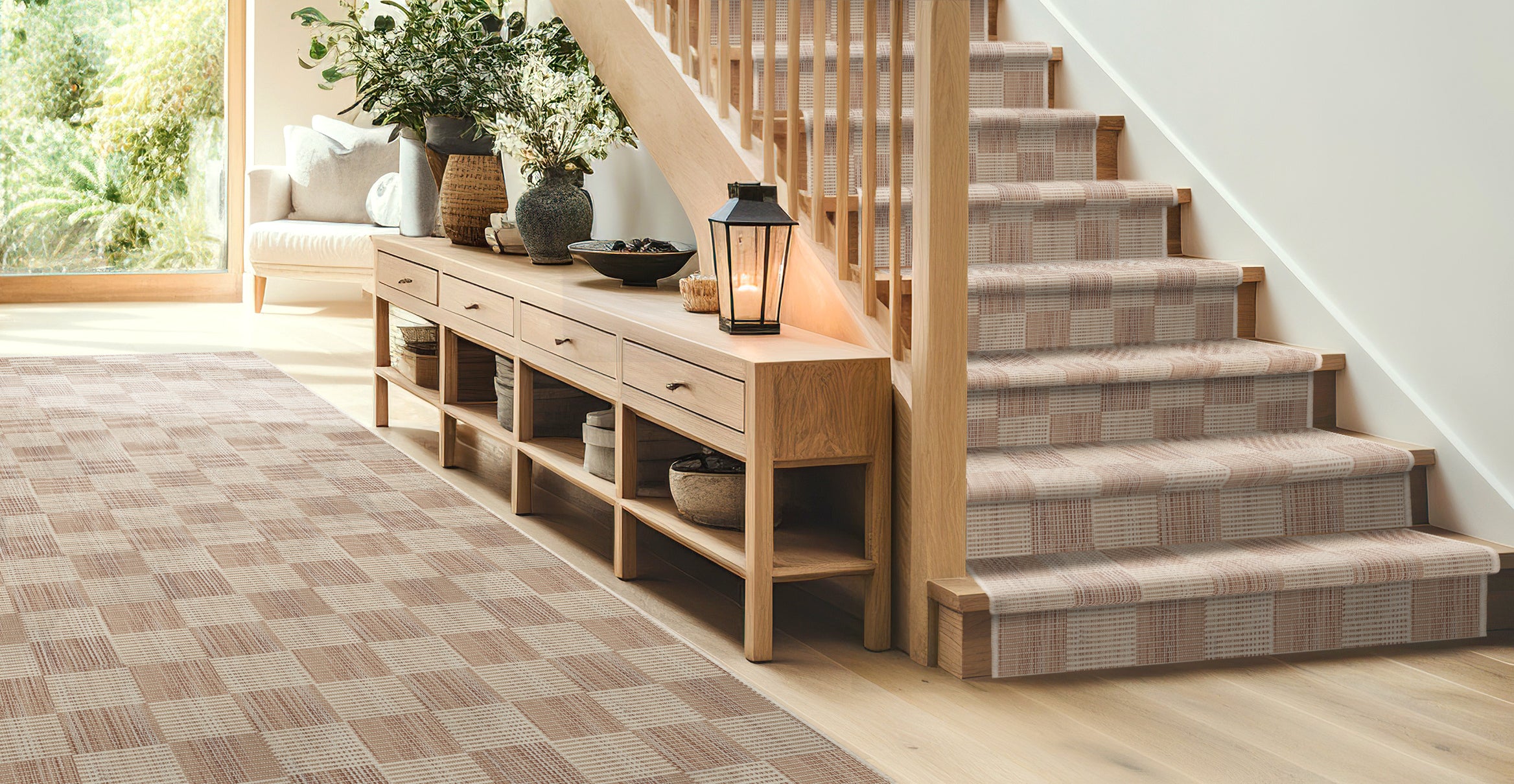 Home interior scene with staircase and beige checkered rug runner
