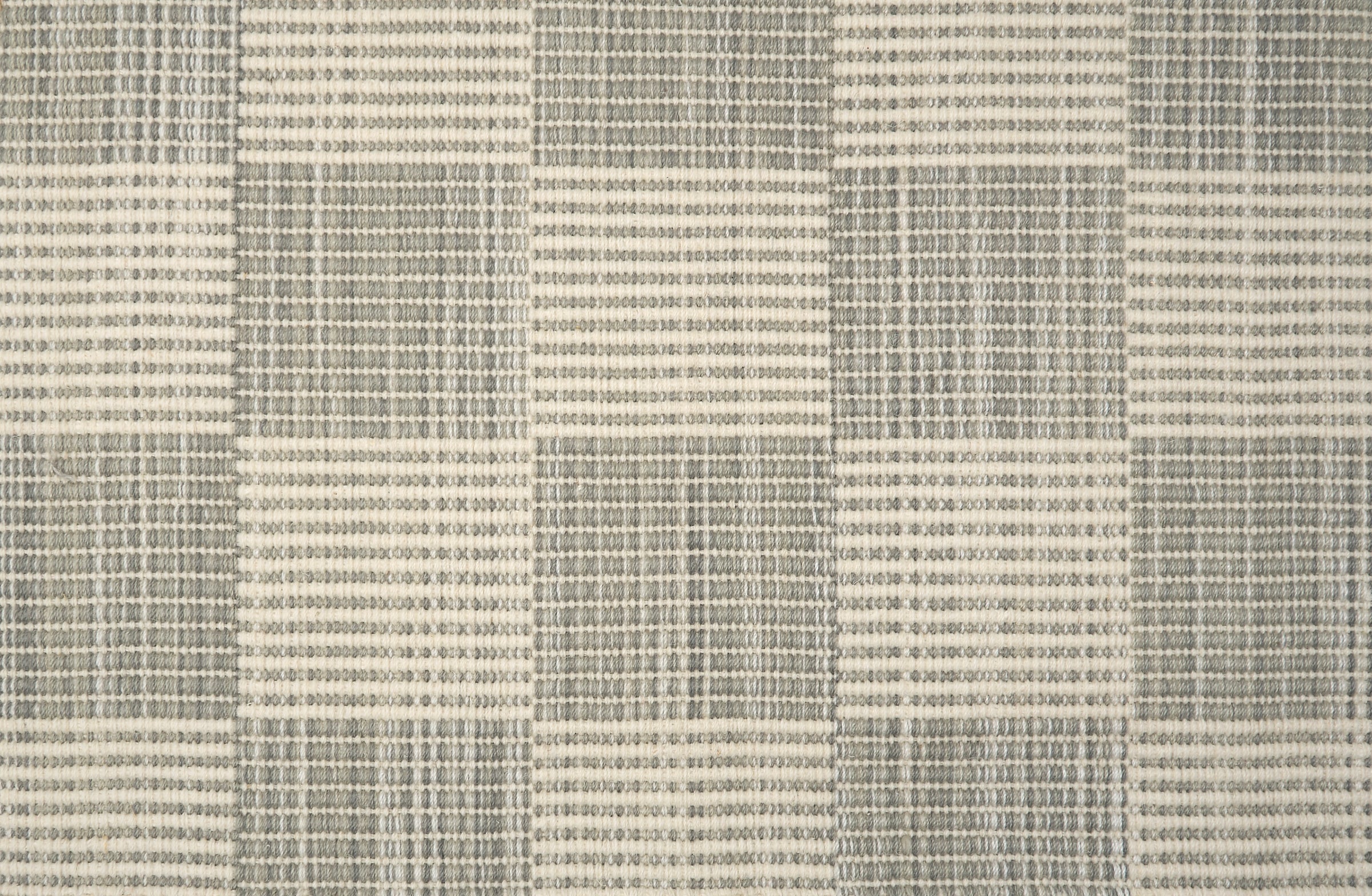 Textured gray and white checkered rug pattern