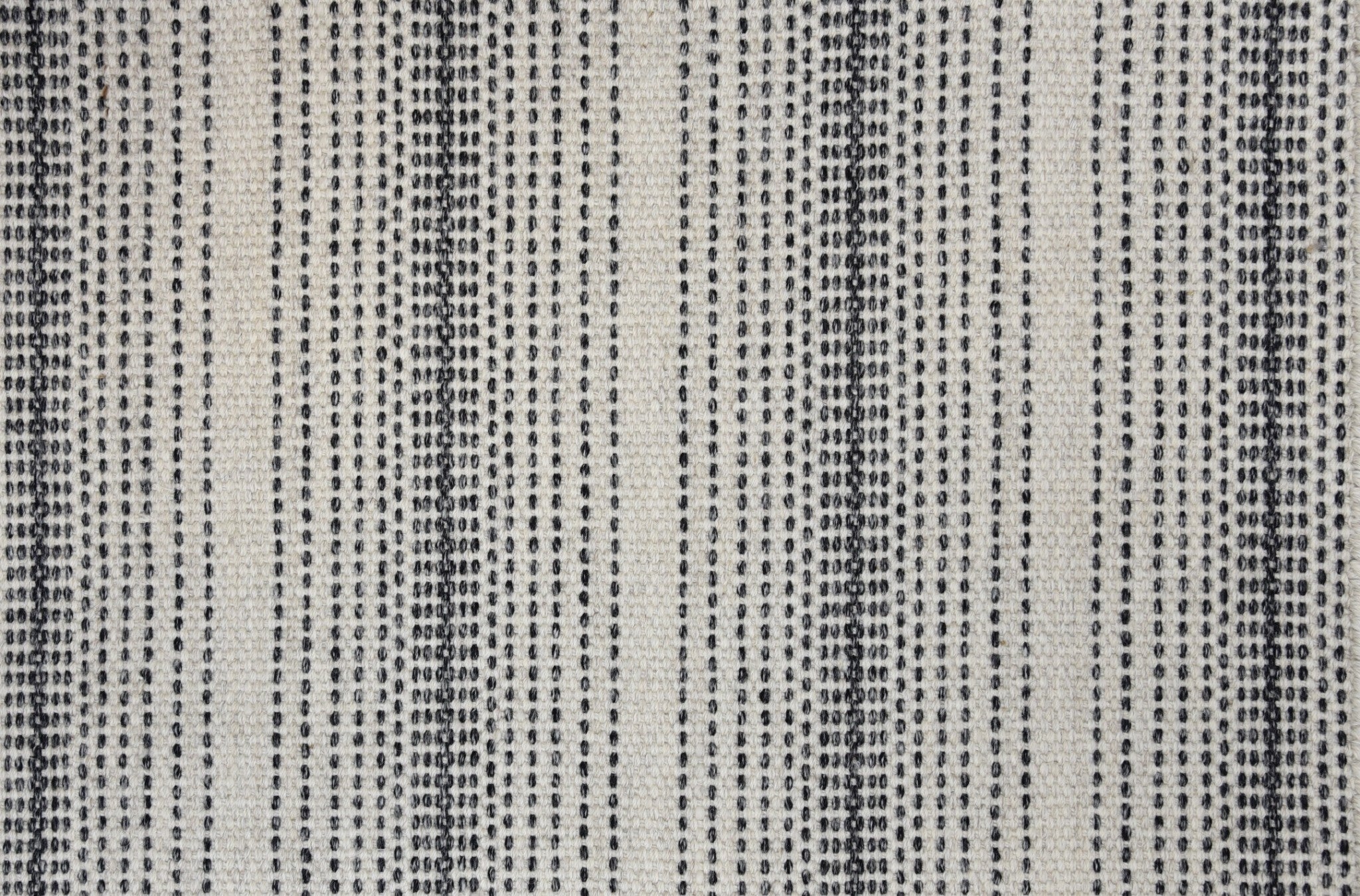 Textured marble-colored fabric with alternating black and gray vertical stripes