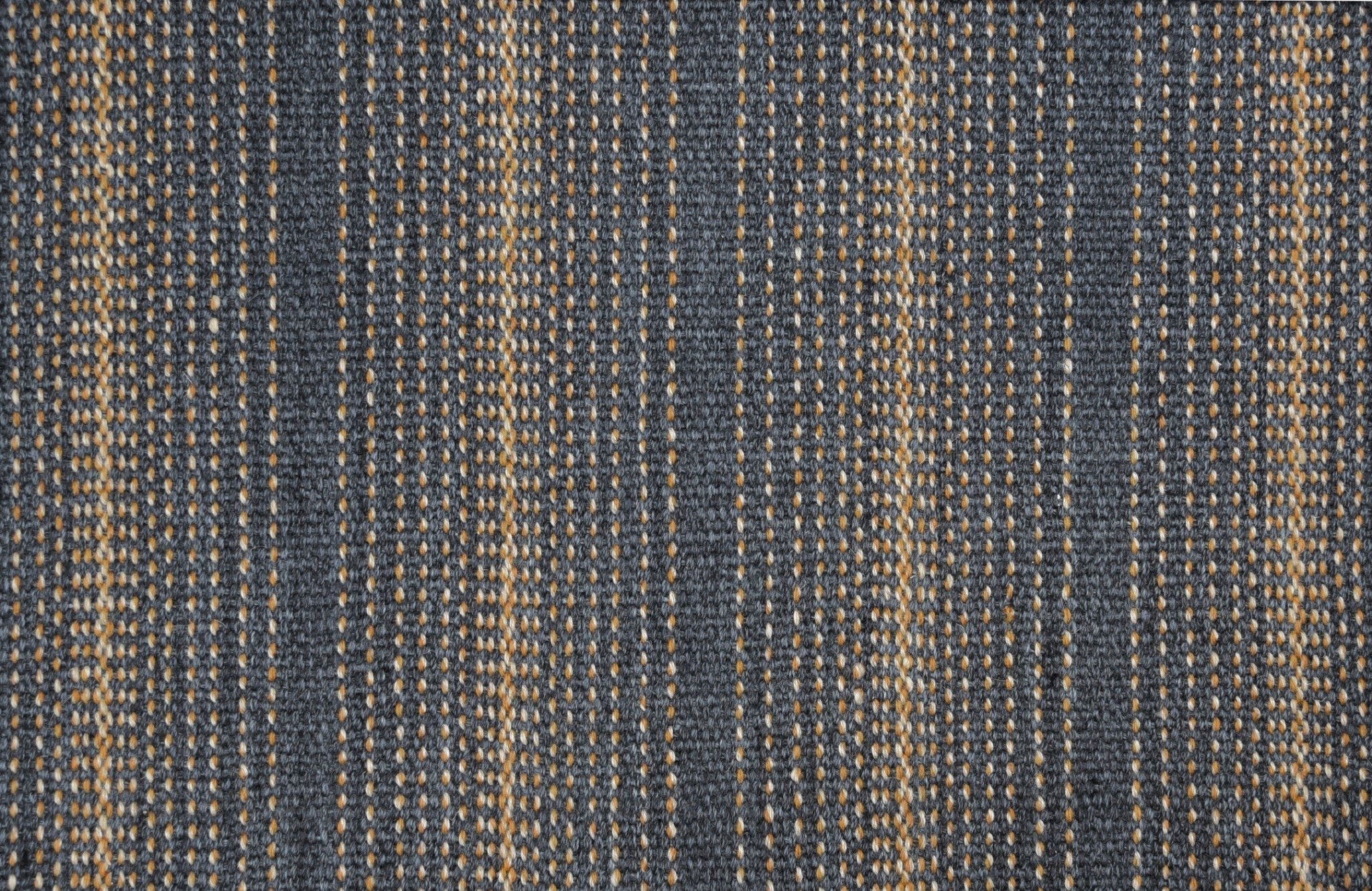 Textured denim-colored fabric with navy and beige vertical stripe pattern