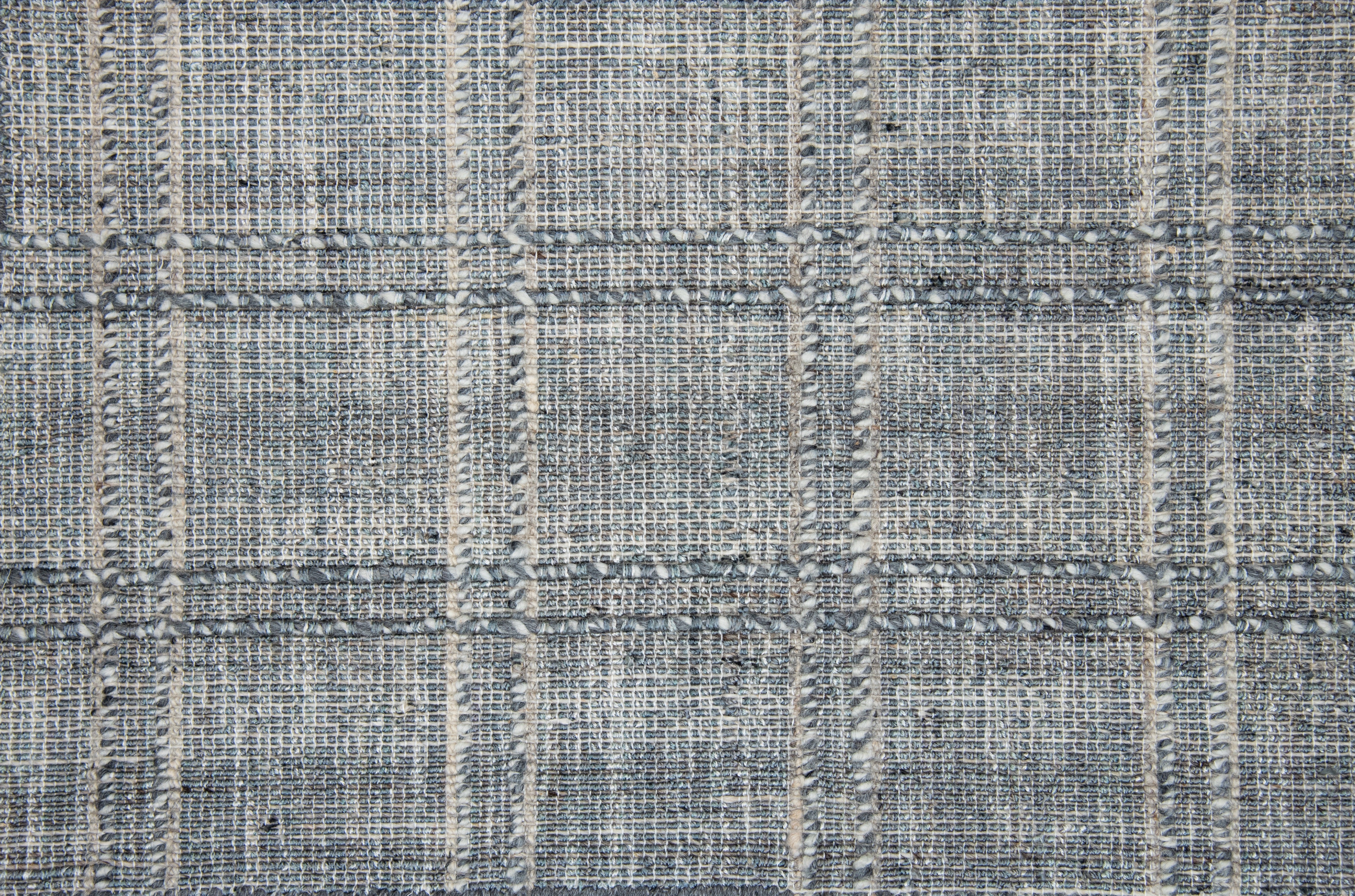 Textured gray and beige checkered tweed rug pattern