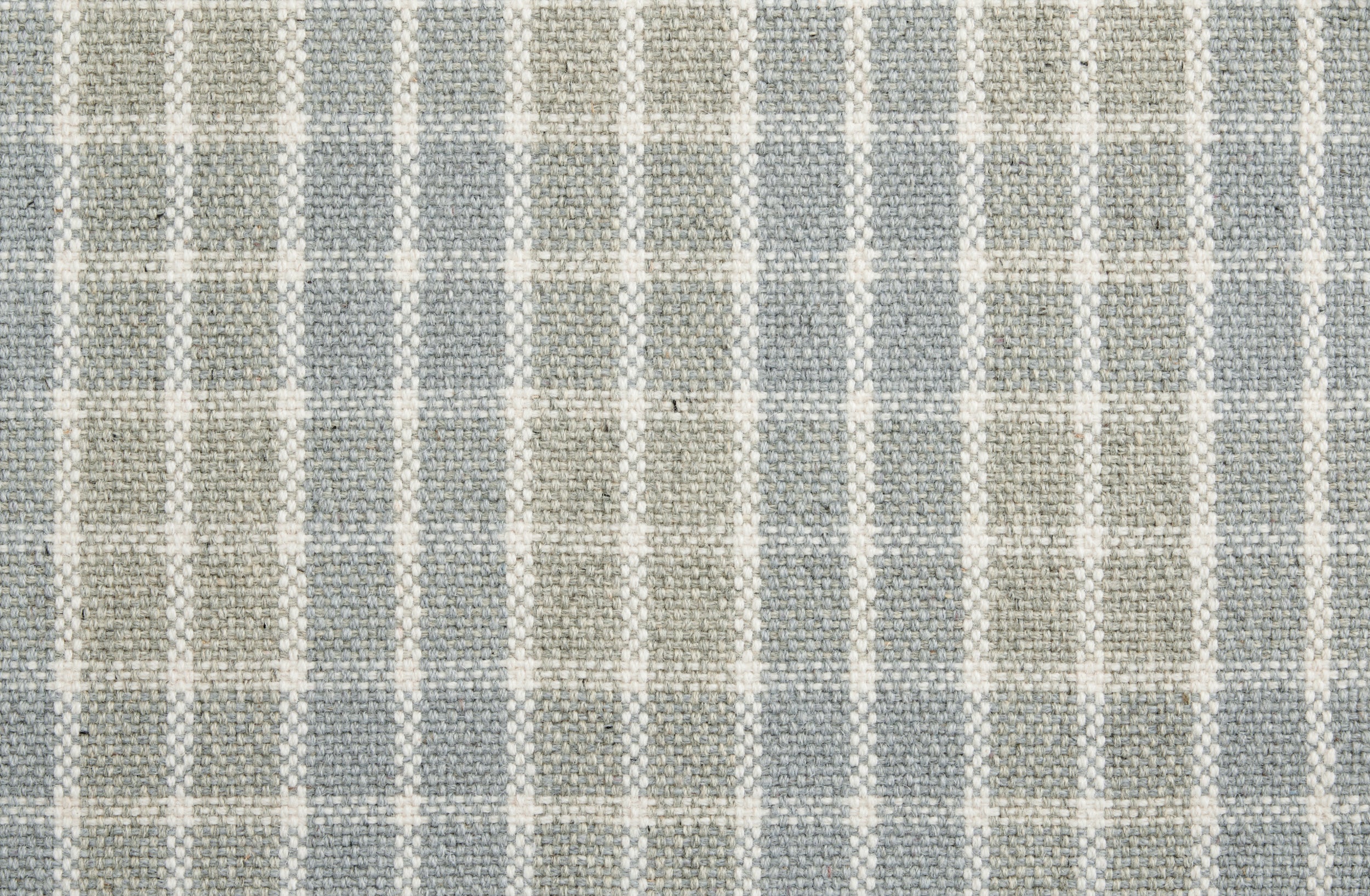 Gray and beige checkered fabric rug with textured pattern